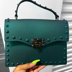 Women emerald green handbag.. new without tags